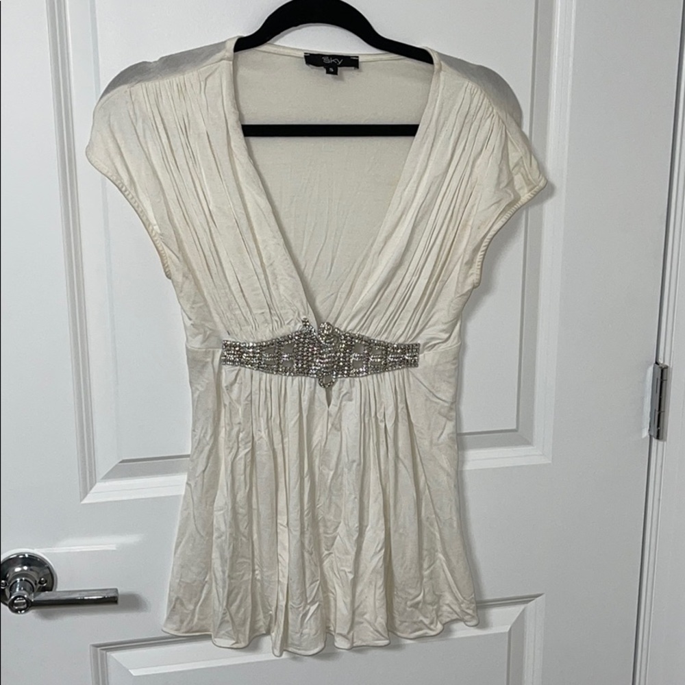 low v neck top with diamonds at the middle